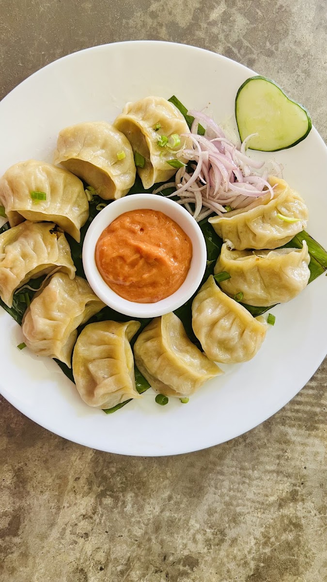 Steamed Momos with fiery chutney